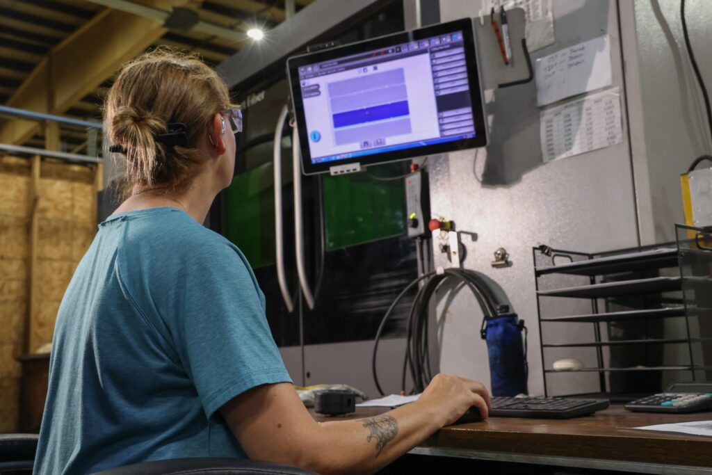 Team member programming at a machine control workstation