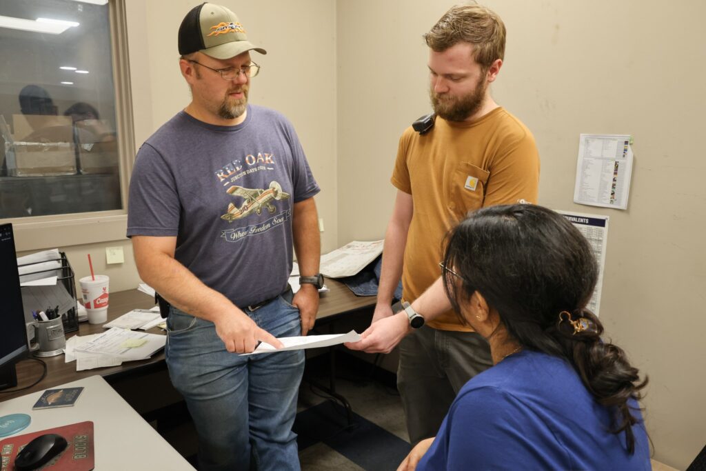 Red Oak team members reviewing a part drawing together